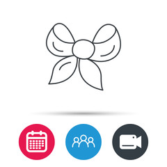 Gift bow icon. Present decoration sign. Ribbon for packaging symbol. Group of people, video cam and calendar icons. Vector