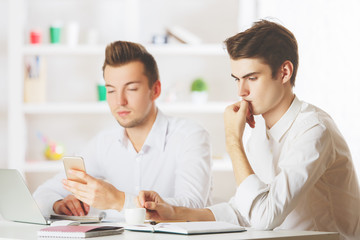 Businessmen using smartphone