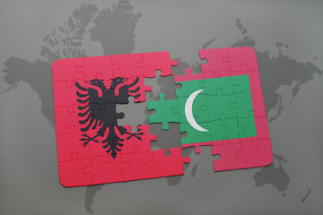 puzzle with the national flag of albania and maldives on a world map