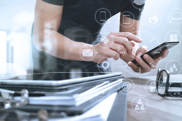 Designer hand using mobile payments online shopping,omni channel