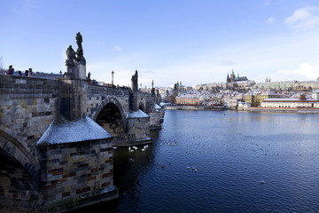 Snowy freeze Prague Lesser Town with gothic Castle and Charles Bridge, Czech republic