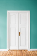 mint green walls and wooden door in apartment