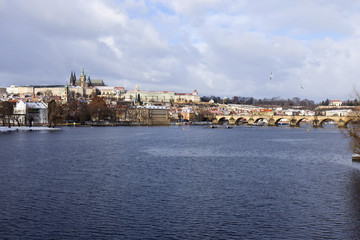 Snowy freeze Prague Lesser Town with gothic Castle and Charles Bridge, Czech republic