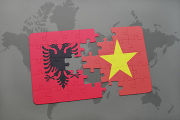 puzzle with the national flag of albania and vietnam on a world map