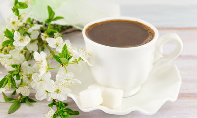 Cup of coffee and spring flowers