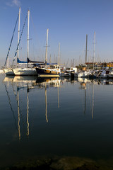 Fototapeta na wymiar Boats and yachts moored at the port.
