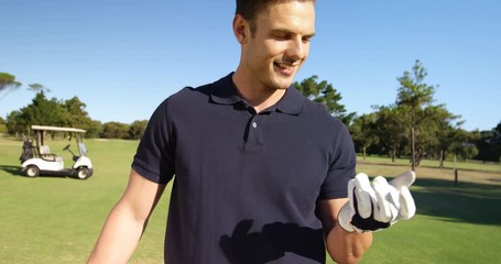 Golf player playing with the ball at golf course