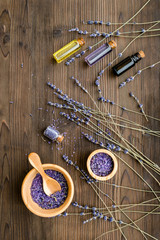 organic cosmetics with lavender on wooden background top view