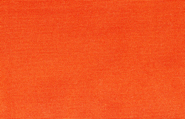 Close up of orange canvas texture or background