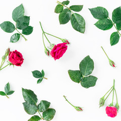 Pattern with red roses, branches and leaves isolated on white background. flat lay, overhead view