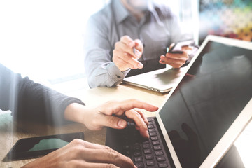 two colleague web designer discussing data and digital tablet do