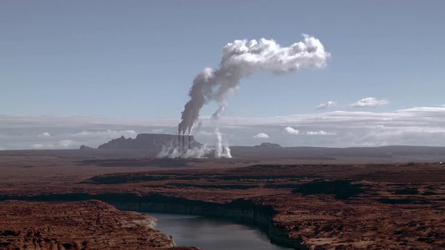 Steam Rises from Desert Power Plant Cooling Towers