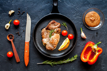 concept cooked steak on dark background top view