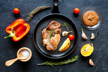 concept cooked steak on dark background top view