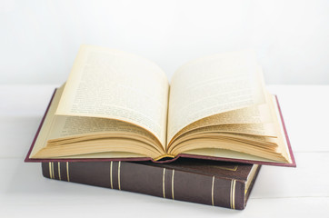 Old book opened on white background