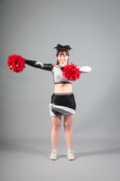 Studio Shot of Cheerleader Posing