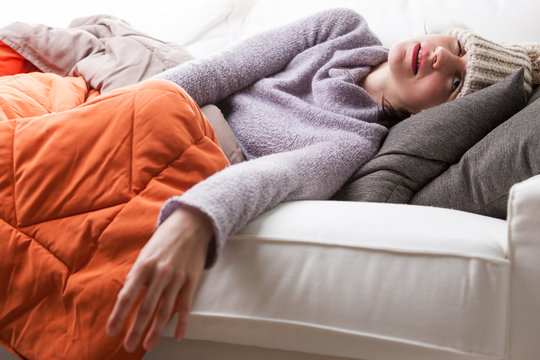 woman on her couch has the flu