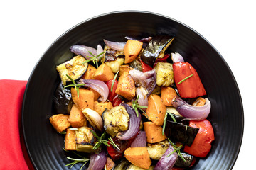 Roasted Vegetables on Black Platter over white