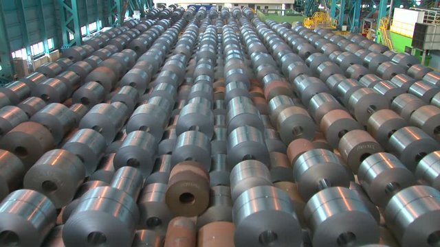Transporter moves big roll of aluminum at metallurgical plant HDV to HD