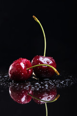Two juicy fresh wet cherries