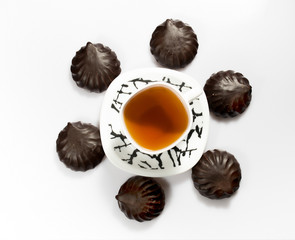 Delicious tea with marshmallow and tangerines. zephyr chocolate.
