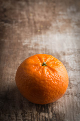 Orange on a rustic wooden background 
