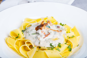 Pasta with cream sauce with chanterelle