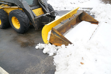 truck with snowplow installed in the residential street