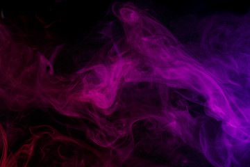 Abstract smoke Weipa. Personal vaporizers fragrant steam. The concept of alternative non-nicotine smoking. Lilac smoke on a black background. E-cigarette. Evaporator. Taking Close-up. Vaping.