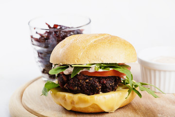 Vegetarian burger with cheese and vegetables