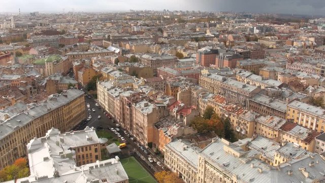 Aerial view or shot of historical city center of Saint Petersburg with old tin roofs and classical buildings of 19-20th century