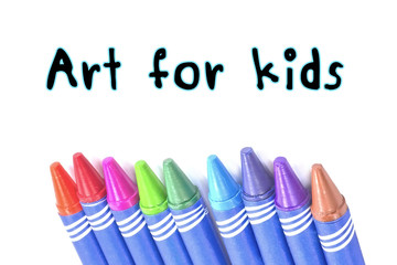 Art for kids text with Selective focus Crayons background