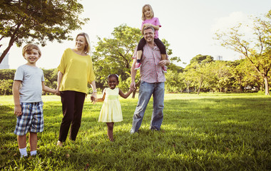 Fototapeta premium Family Walking Field Nature Togetherness Concept