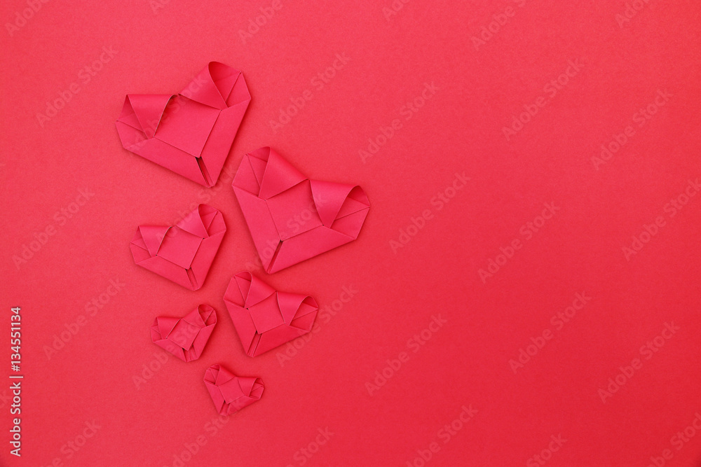 Poster six folding red paper hearts on red for valentine pattern and ba