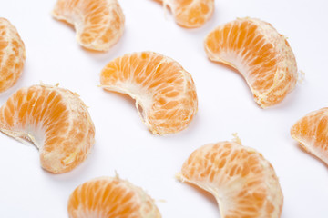 Peeled mandarin isolated on white background.