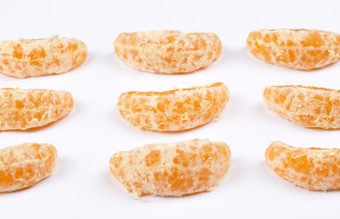 Peeled mandarin isolated on white background.