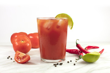 Bloody Mary cocktail with lime and chili peppers