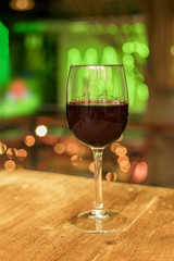 Glass of red wine on blurred background