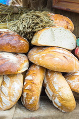 Freshly baked traditional loaves of rye bread on stall