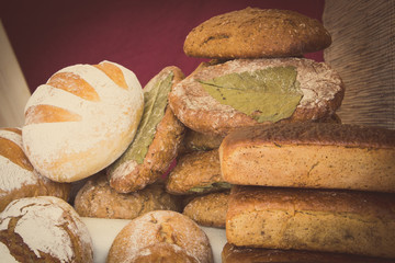 Vintage photo, Freshly baked traditional loaves of rye bread on stall
