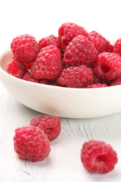 Raspberries in white bowl