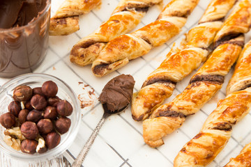 homemade cakes - puff pastry with chocolate paste. twisted cakes