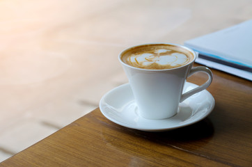 White Coffee Cup on Wood Desk in Morning