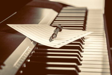 music notes on piano keys