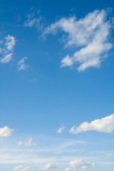 Beautiful coudscape over horizon. White clouds in blue sky.