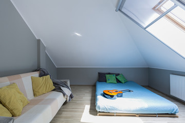 Attic minimalist bedroom with mattress - obrazy, fototapety, plakaty