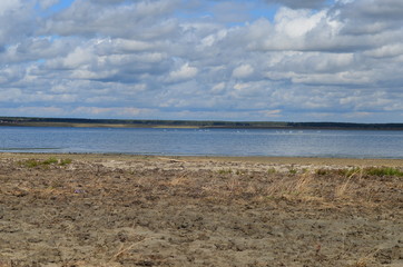 the shore of the lake in the fall
