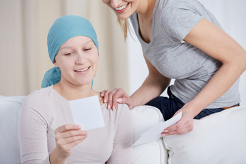 Cancer woman watching photos