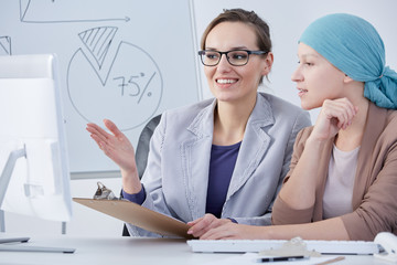 Cancer woman working at office
