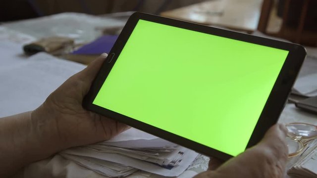 A Blank Tablet PC In Landscape Orientation With A Green Screenin Hands. 4k